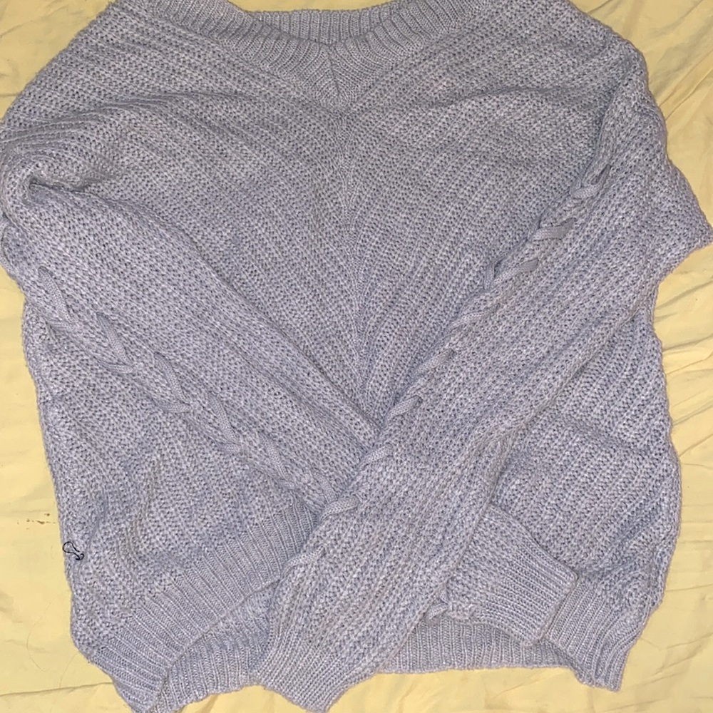 It’s a sweater shirt it’s light grey the brand is ICON APPAREL